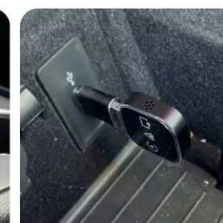 The adapter plugged into a car USB port