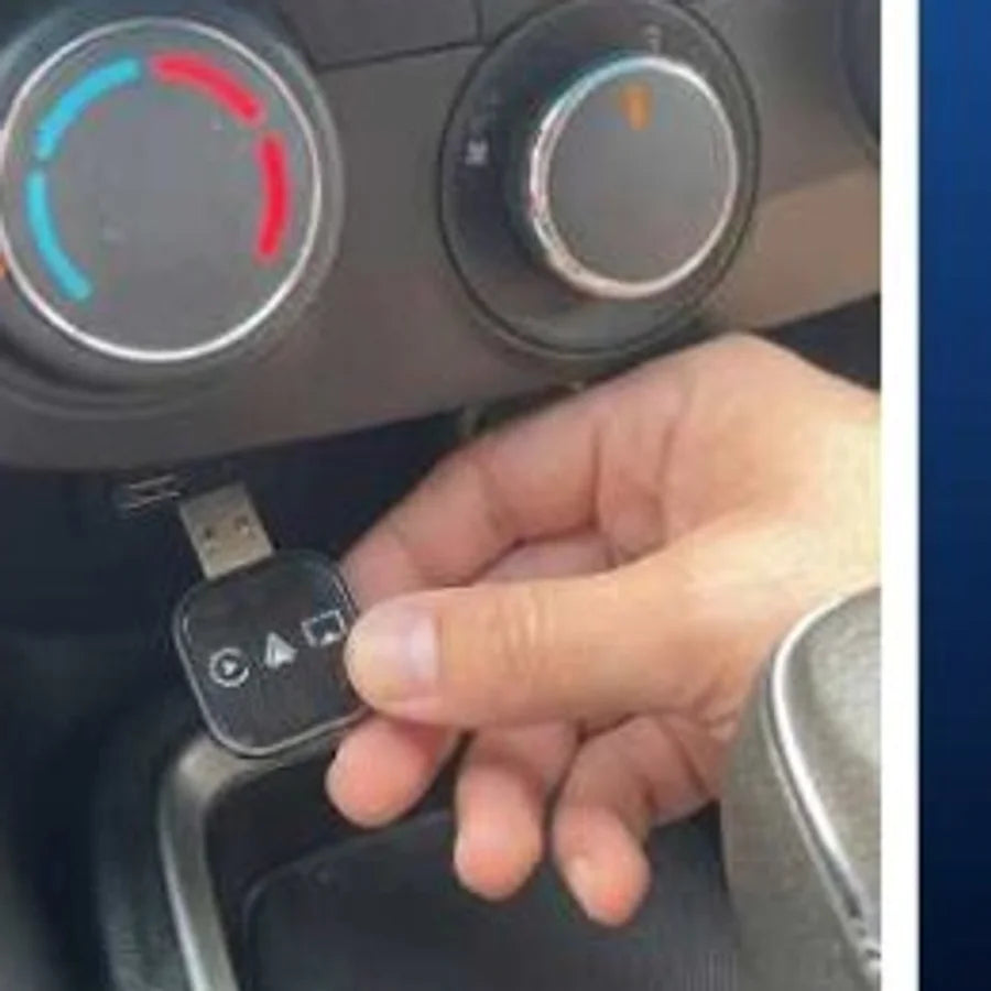 Holding the adapter next to the car USB port