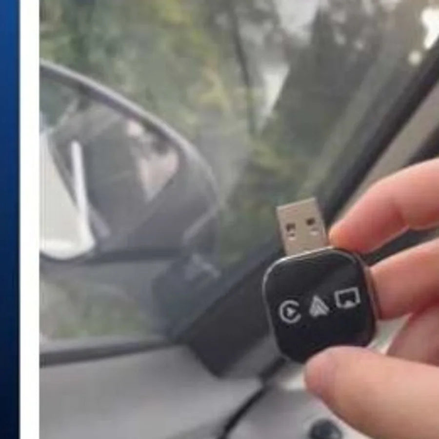 The adapter held up inside the car