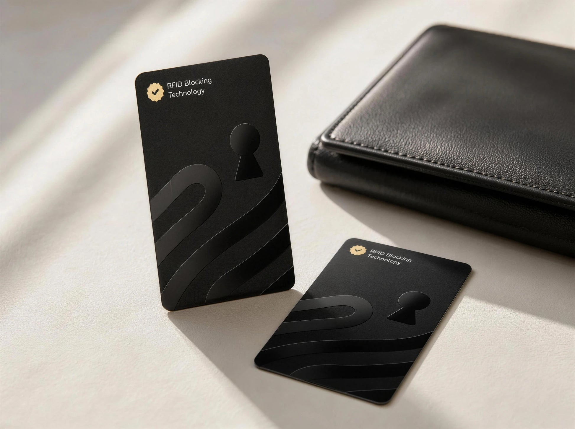 Guardality RFID and NFC blocking cards beside an everyday wallet