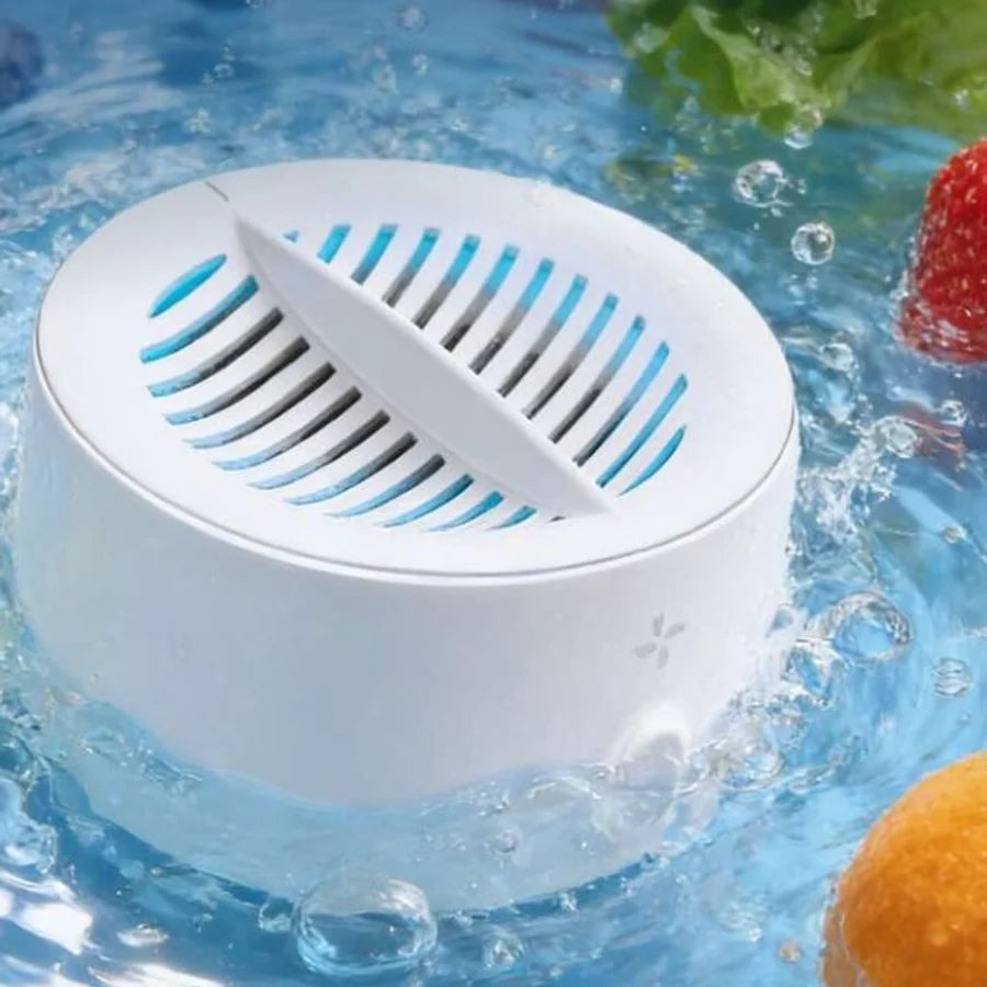 PuriBreeze puck running in a bowl of water with fruit